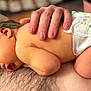 newborn, baby, infant, diaper, hand, skin, chest_hair, resting, sleeping, closeup, human, person, tenderness, bonding, care, family, comfort, soft_light, indoors, portrait