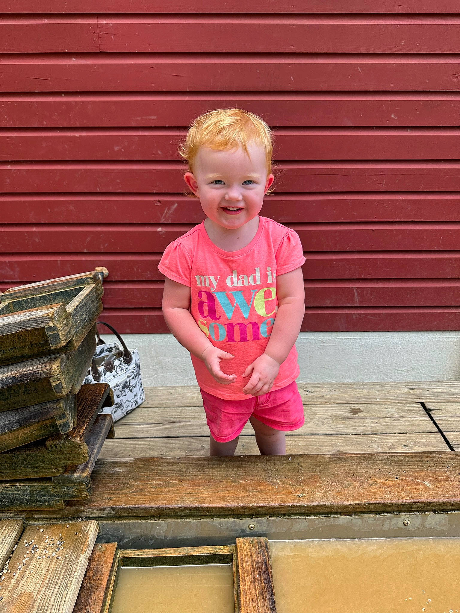 Josey joined the competition — help win amazing prizes! baby_toddler_clothing, child, face, flooring, grass, happy, hardwood, joy, leisure, magenta, person, pink, rectangle, sitting, sleeve, smile, standing, t_shirt, tints_and_shades, toddler