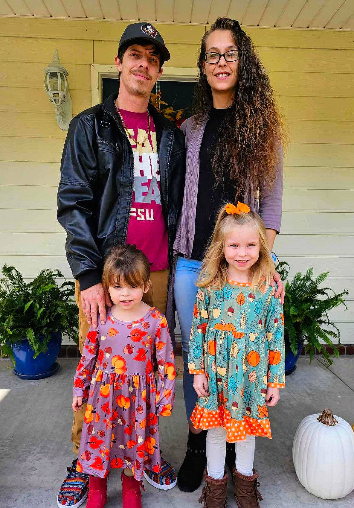 Skylar is registered to the contest to win money with this photo: calabaza, cap, clothing, community, cucurbita, fashion, flowerpot, fun, happy, hat, head, headwear, houseplant, joy, orange, outerwear, person, plant, pumpkin, shoe