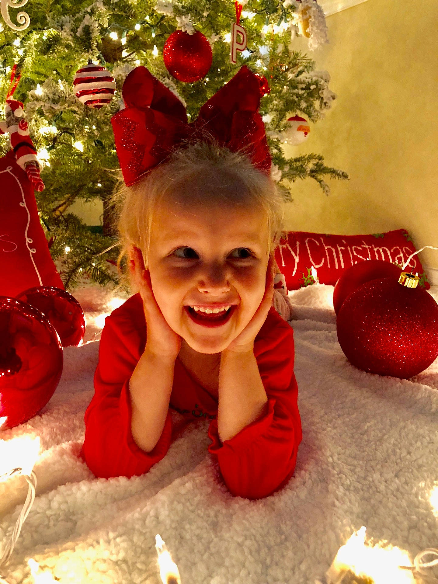 Paisley joined the competition — help win amazing prizes! christmas, christmas_decoration, christmas_ornament, girl, hair_accessory, happiness, holiday, joy, person, petal, smile, toddler