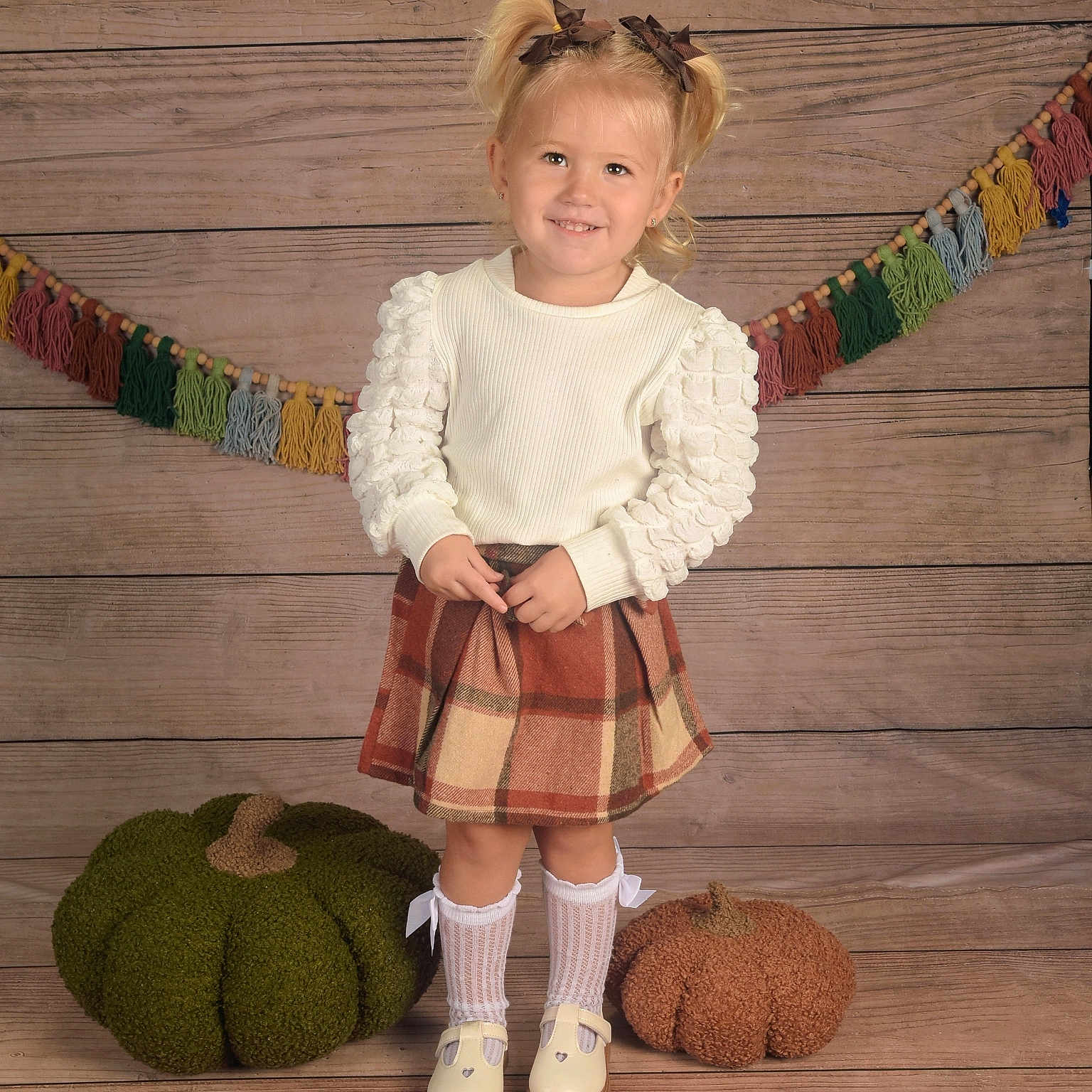 Wrennlynn is registered to the contest to win money with this photo: child, clothing, coat, face, female, food, fruit, furniture, girl, head, kilt, miniskirt, person, photography, plant, portrait, produce, pumpkin, skirt, tartan
