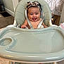 Amiyah joined the competition — help win amazing prizes! baby, high_chair, headband, smile, happy, infant, face, tongue, hand, foot, straps, chair, indoor, floor, curtain, wall, blanket, person, cute, joy