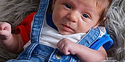 Hayes joined the competition — help win amazing prizes! baby, blue_eyes, blue_shirt, brown_hair, casual, child, clothing, cute, denim_overalls, face, fluffy_rug, hand, indoor, infant, person, portrait, red_shirt, skin, soft_texture, young