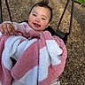 Nova Rose joined the competition — help win amazing prizes! baby, child, swing, blanket, smile, happy, outdoor, playground, wood_chips, grass, person, infant, cute, joyful, seat, clothing, face, head, young, fun
