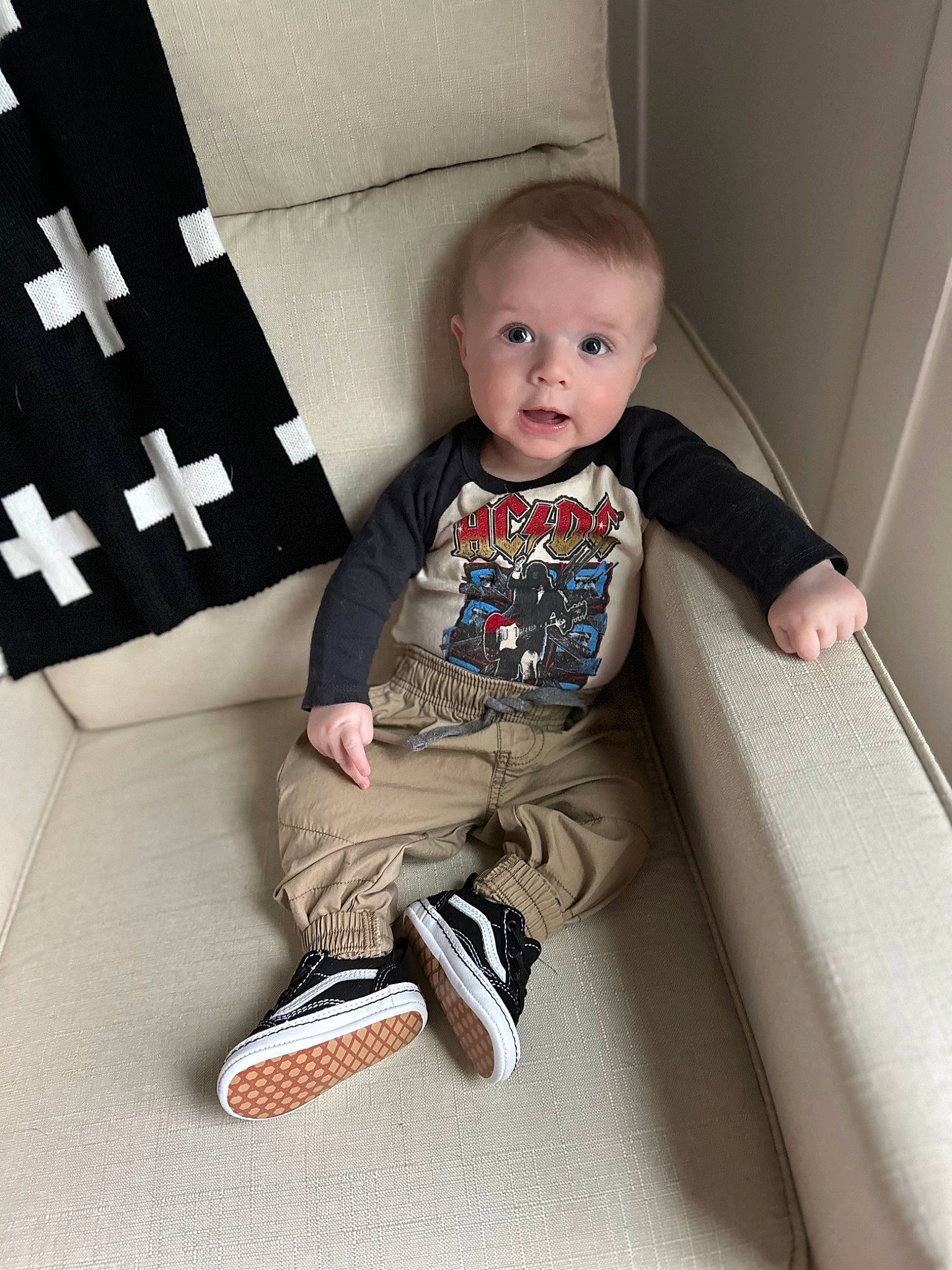 Colter joined the competition — help win amazing prizes! baby, baby_toddler_clothing, carmine, child, collar, comfort, flooring, human_leg, knee, pattern, person, product, rectangle, room, sitting, sleeve, sock, t_shirt, thigh, toddler