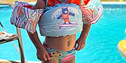 Eliza joined the competition — help win amazing prizes! child, pool, swimwear, floaties, goggles, water, summer, outdoor, happy, smiling, safety, playful, sunlight, fun, vacation, kid, swimming, toy, colorful, backyard