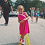 Eliza joined the competition — help win amazing prizes! background, casual, child, crowd, daylight, fun, girl, outdoor, people, pink_dress, police_officer, road, shoes, smiling, street, summer, sunglasses, trees, walking, yellow_line