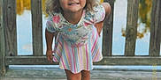 Eliza joined the competition — help win amazing prizes! casual_clothing, child, curly_hair, fence, floral_top, girl, happy, innocence, lake, nature, outdoor, person, playful, portrait, smiling, striped_skirt, summer, sunlight, white_boots, wooden_deck
