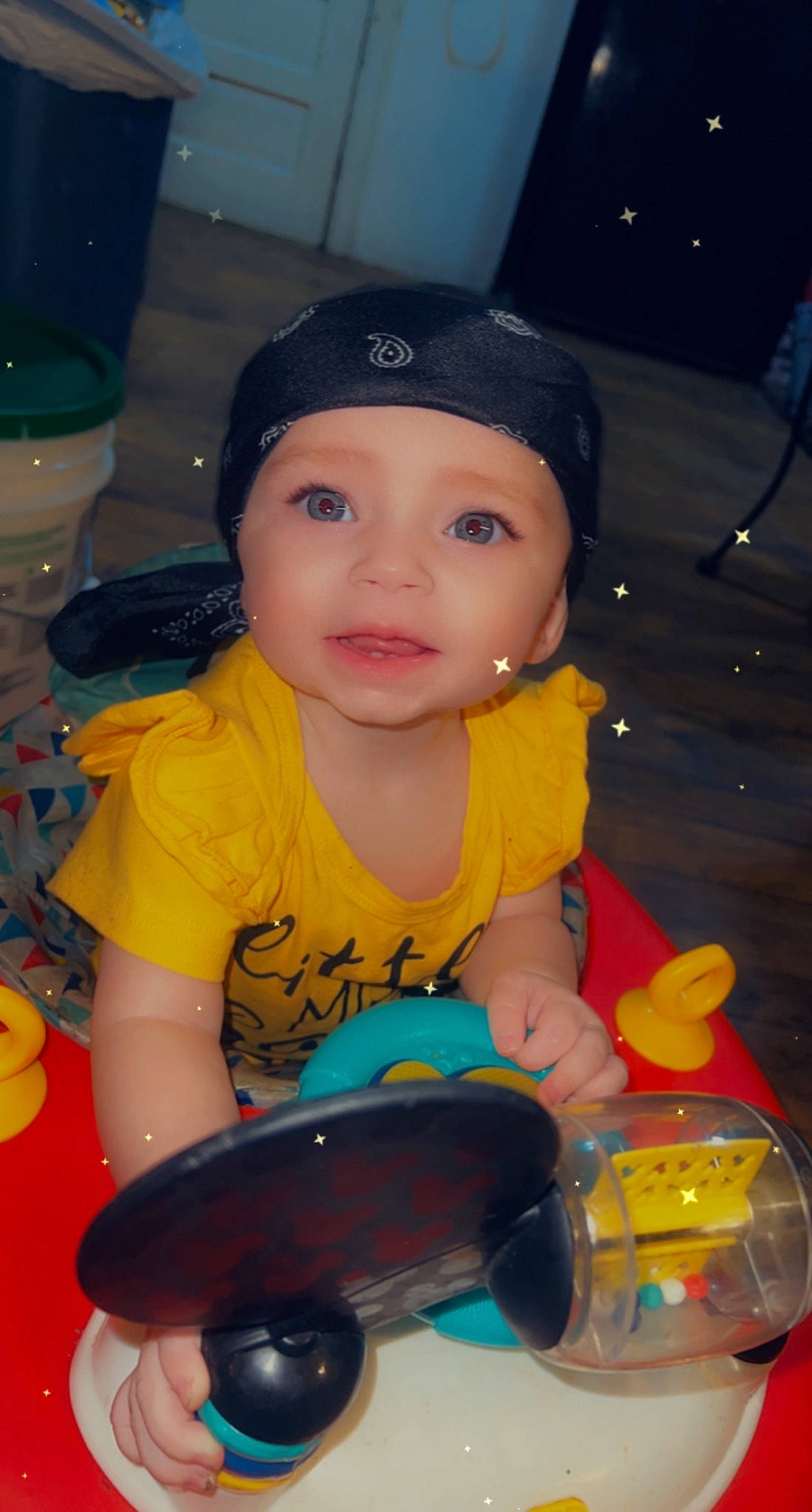 Amoura is registered to the contest to win money with this photo: baby, baby_toys, baseball_cap, cap, cheek, child, fun, happy, headwear, leisure, mouth, nose, organ, person, plastic, play, recreation, sitting, snapshot, toddler