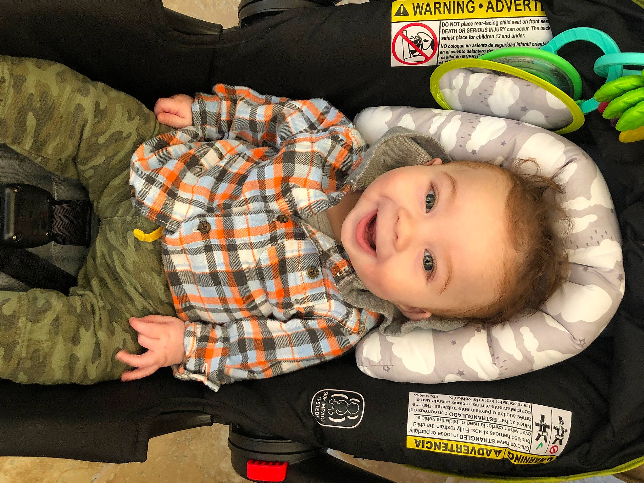 Chandler joined the competition — help win amazing prizes! baby, baby_products, baby_toddler_clothing, child, comfort, couch, design, flooring, fun, happy, lap, pattern, person, plaid, room, sitting, smile, sock, tartan, toddler