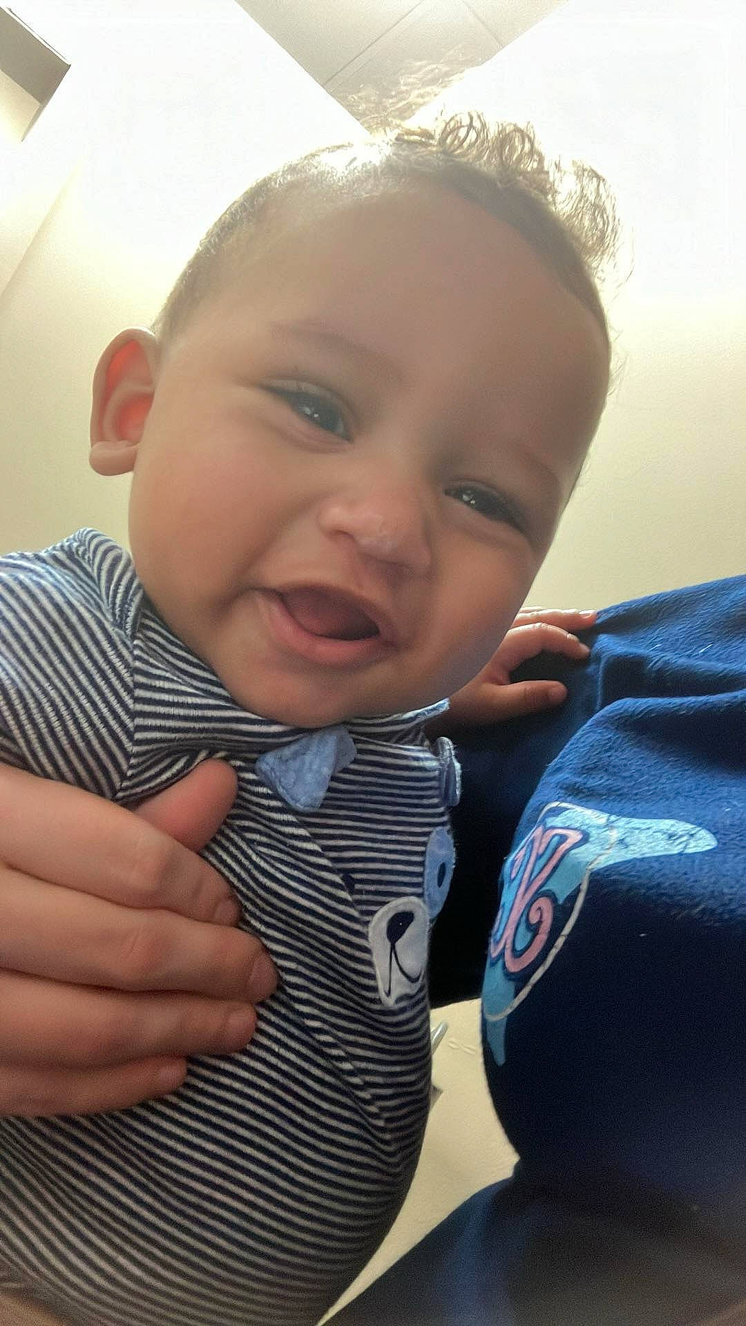 Onyx is registered to the contest to win money with this photo: baby_toddler_clothing, cheek, collar, comfort, dress_shirt, eye, eyelash, finger, gesture, hand, happy, head, iris, lip, mouth, neck, nose, person, skin, sleeve