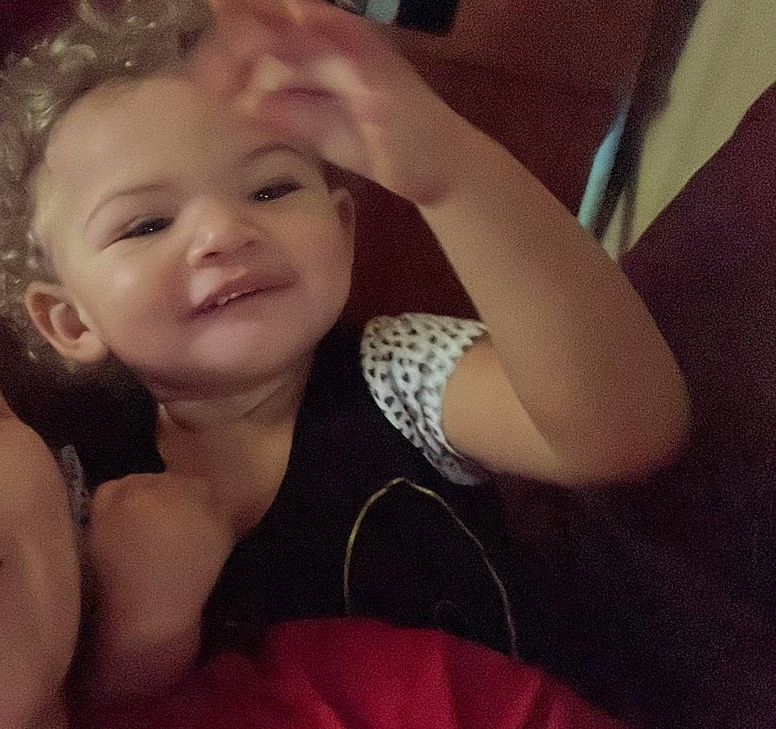 Ta'Leeia is registered to the contest to win money with this photo: arm, baby_toddler_clothing, cloud, comfort, cool, ear, elbow, finger, flash_photography, gesture, happy, human_body, iris, lip, mouth, neck, nose, person, sleeve, smile