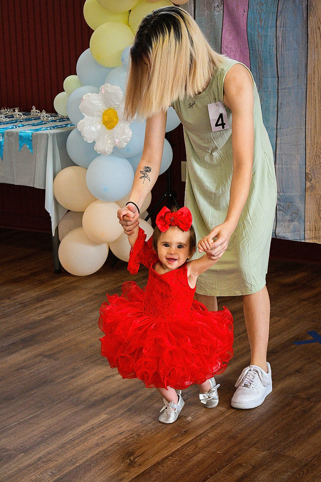 Brinley is registered to the contest to win money with this photo: balloon, child, dress, entertainment, event, fashion_accessory, fashion_design, flooring, formal_wear, fun, fur, gesture, gown, happy, headpiece, joy, magenta, party_supply, performing_arts, person