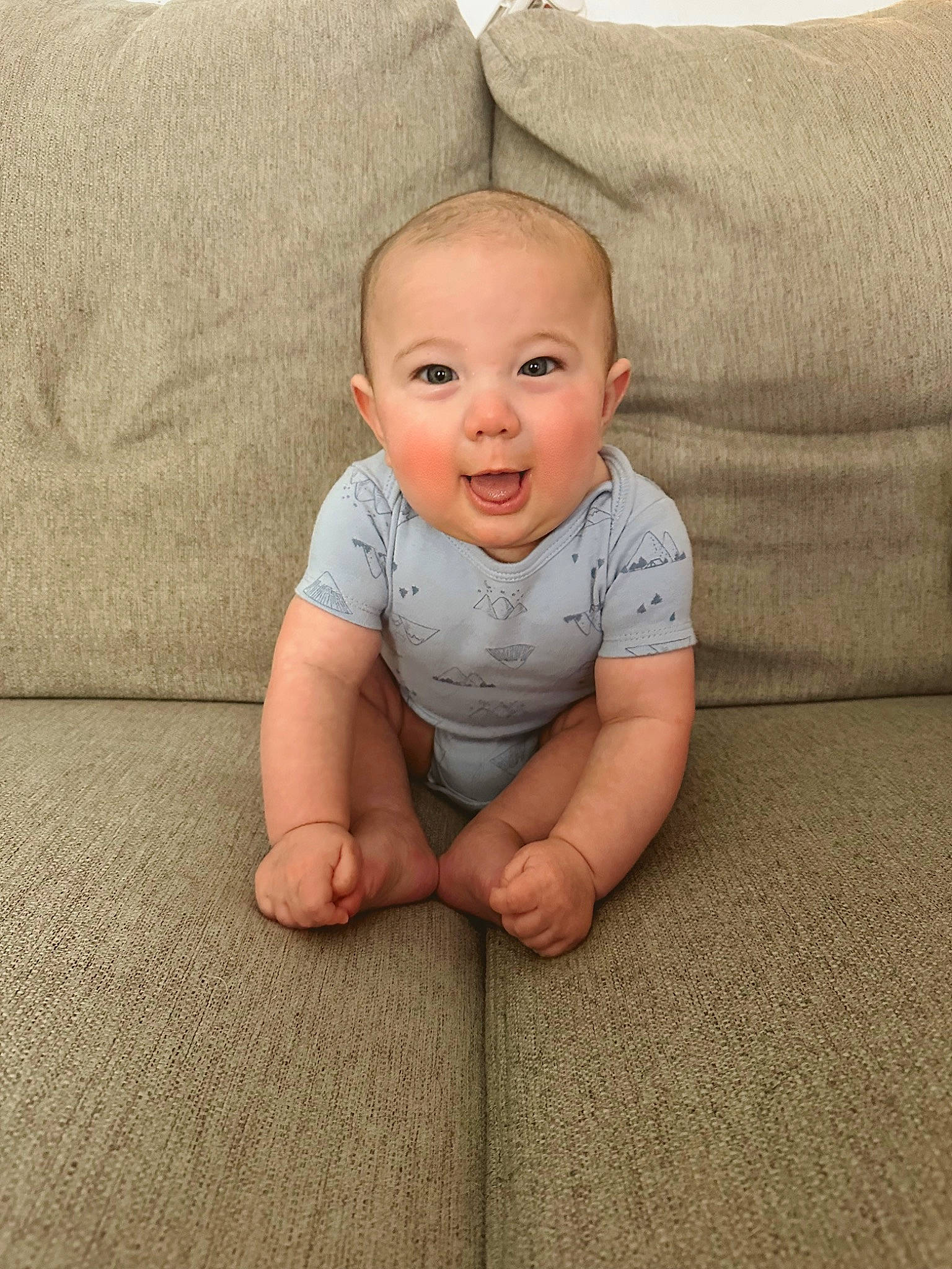 Armani joined the competition — help win amazing prizes! baby, baby_toddler_clothing, cheek, comfort, flash_photography, floor, flooring, foot, happy, hardwood, human_leg, leg, linens, nose, person, sitting, skin, sleeve, smile, toddler