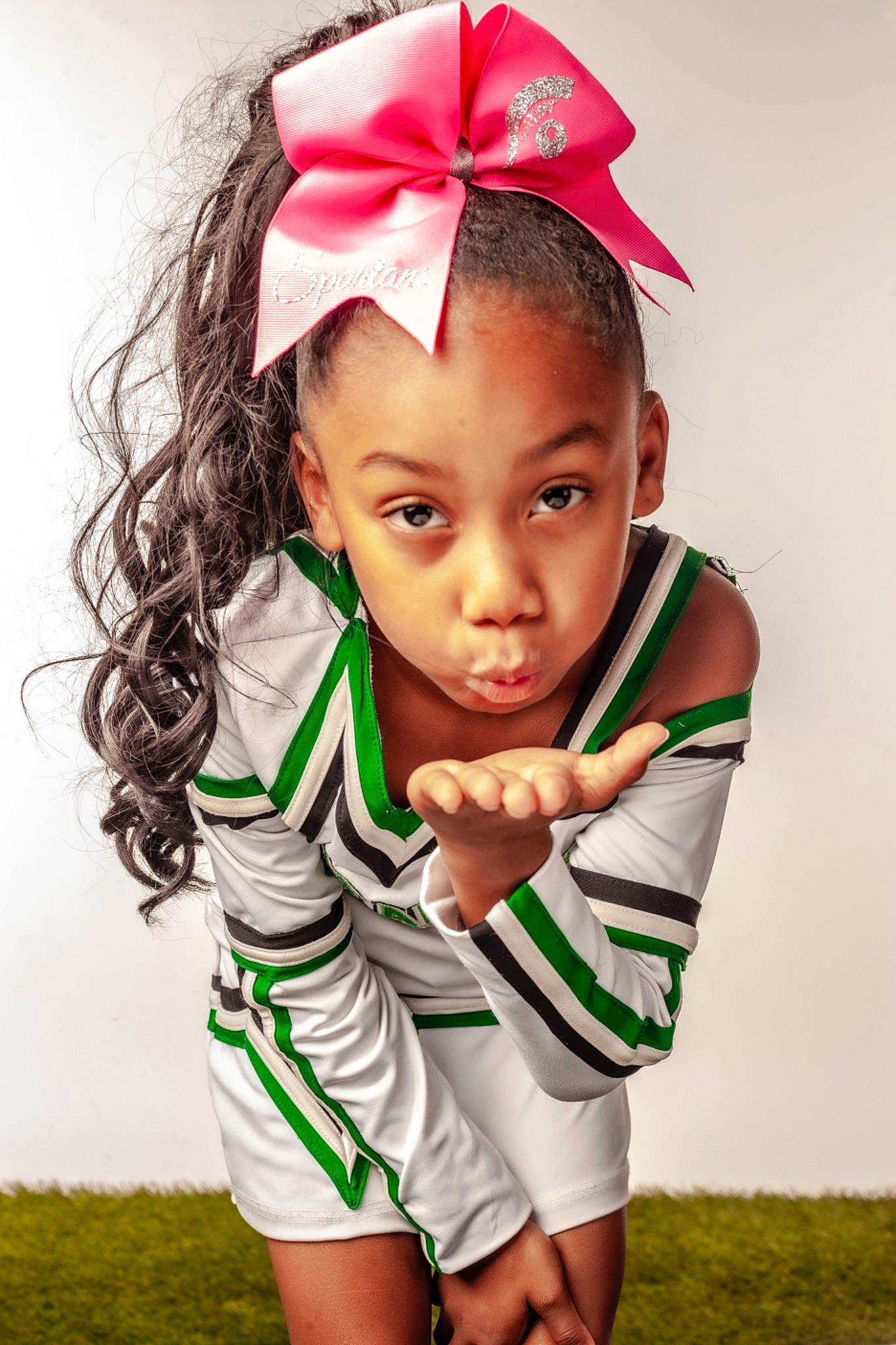 Jazlene is registered to the contest to win money with this photo: baby_toddler_clothing, chin, dress, eye, eyelash, facial_expression, gesture, grass, hair, hand, happy, headgear, human, human_body, neck, outerwear, people_in_nature, person, shoulder, skin