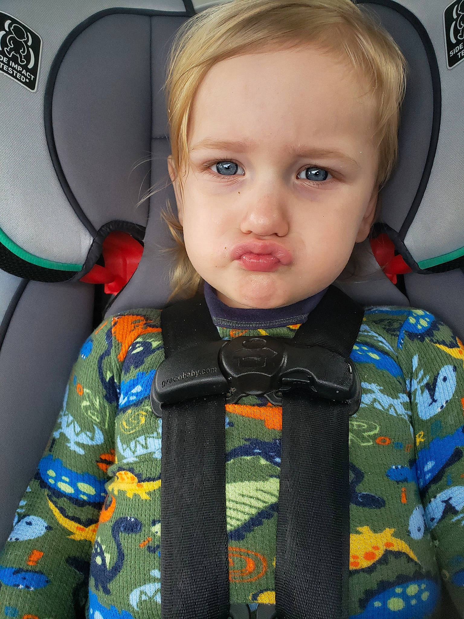 Bradly is registered to the contest to win money with this photo: baby, car_seat, cheek, child, eye, face, head, nose, person, toddler