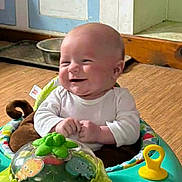 Austin joined the competition — help win amazing prizes! activity_center, baby, baby_toy, child, clothing, colorful, cute, expression, floor, hand, happy, head, indoor, infant, person, playful, room, seat, smiling, toy