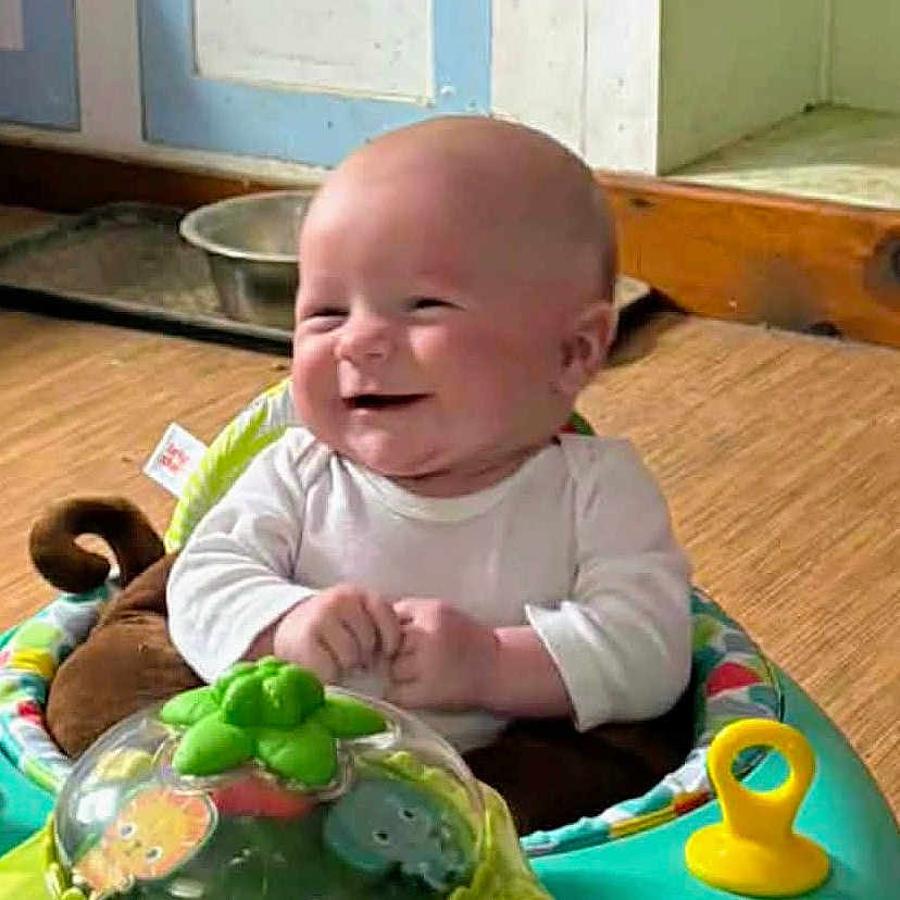 Austin joined the competition — help win amazing prizes! activity_center, baby, baby_toy, child, clothing, colorful, cute, expression, floor, hand, happy, head, indoor, infant, person, playful, room, seat, smiling, toy