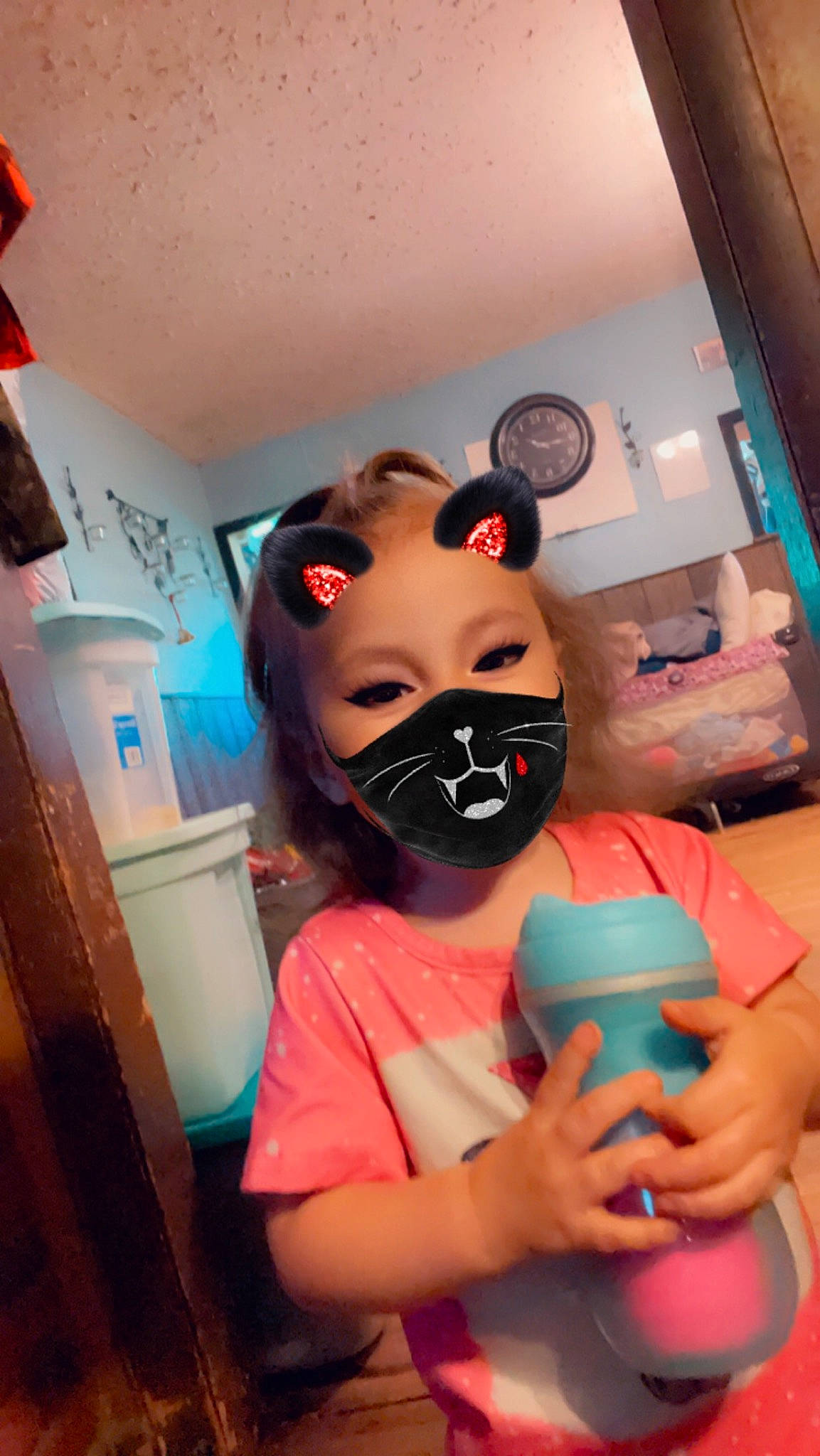 Febeah is registered to the contest to win money with this photo: animation, art, child, costume, drinkware, entertainment, event, eyewear, fictional_character, fun, magenta, mask, nail, person, personal_protective_equipment, plastic, room, t_shirt, tableware, vision_care