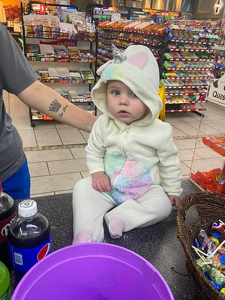 Jordan is registered to the contest to win money with this photo: cap, convenience_store, customer, drinkware, event, fun, hat, headwear, market, natural_foods, person, photograph, product, retail, service, shelf, shopping, snapshot, t_shirt, toddler