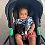 baby, sleeping, stroller, car_seat, harness, child, infant, outdoor, shorts, shirt, black, safety, peaceful, cute, toddler, resting, canopy, seat, hands, legs