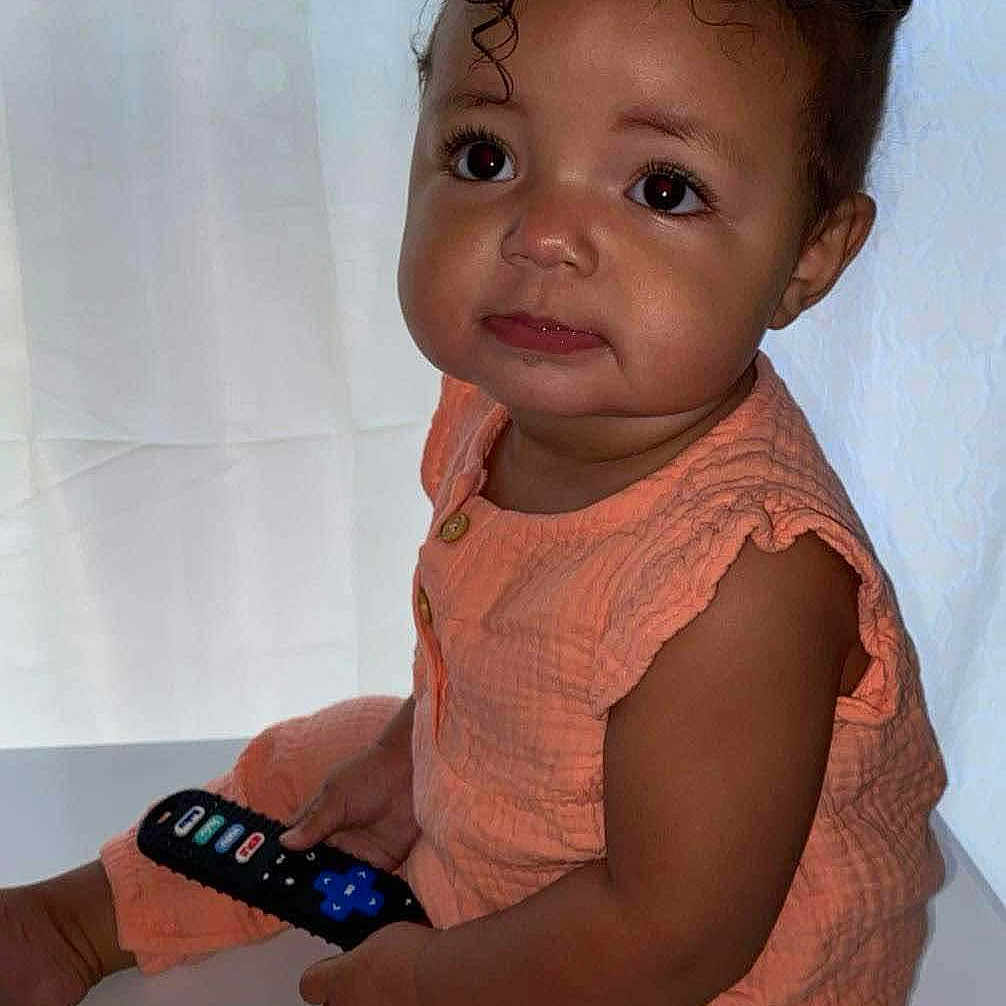 Xylia joined the competition — help win amazing prizes! baby, bodypart, clothing, dress, electronics, face, finger, hand, happy, head, mobilephone, person, phone, photography, portrait, remotecontrol, screen, sitting, sleeve, smile
