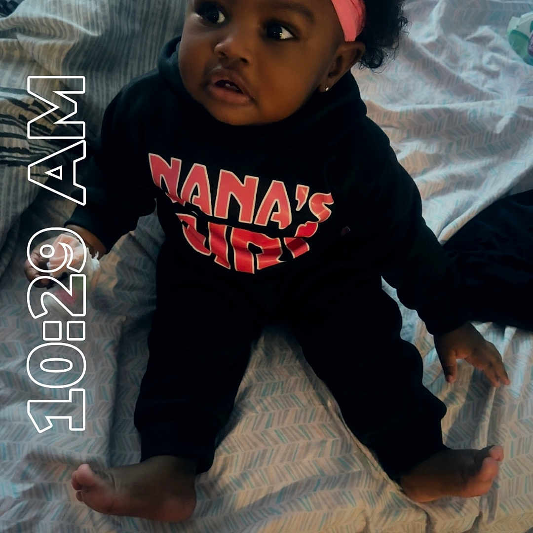 Kamora joined the competition — help win amazing prizes! accessories, baby, bed, bedroom, bodypart, clothing, couch, cushion, face, finger, furniture, hand, hat, head, homedecor, indoors, person, photography, portrait, t_shirt