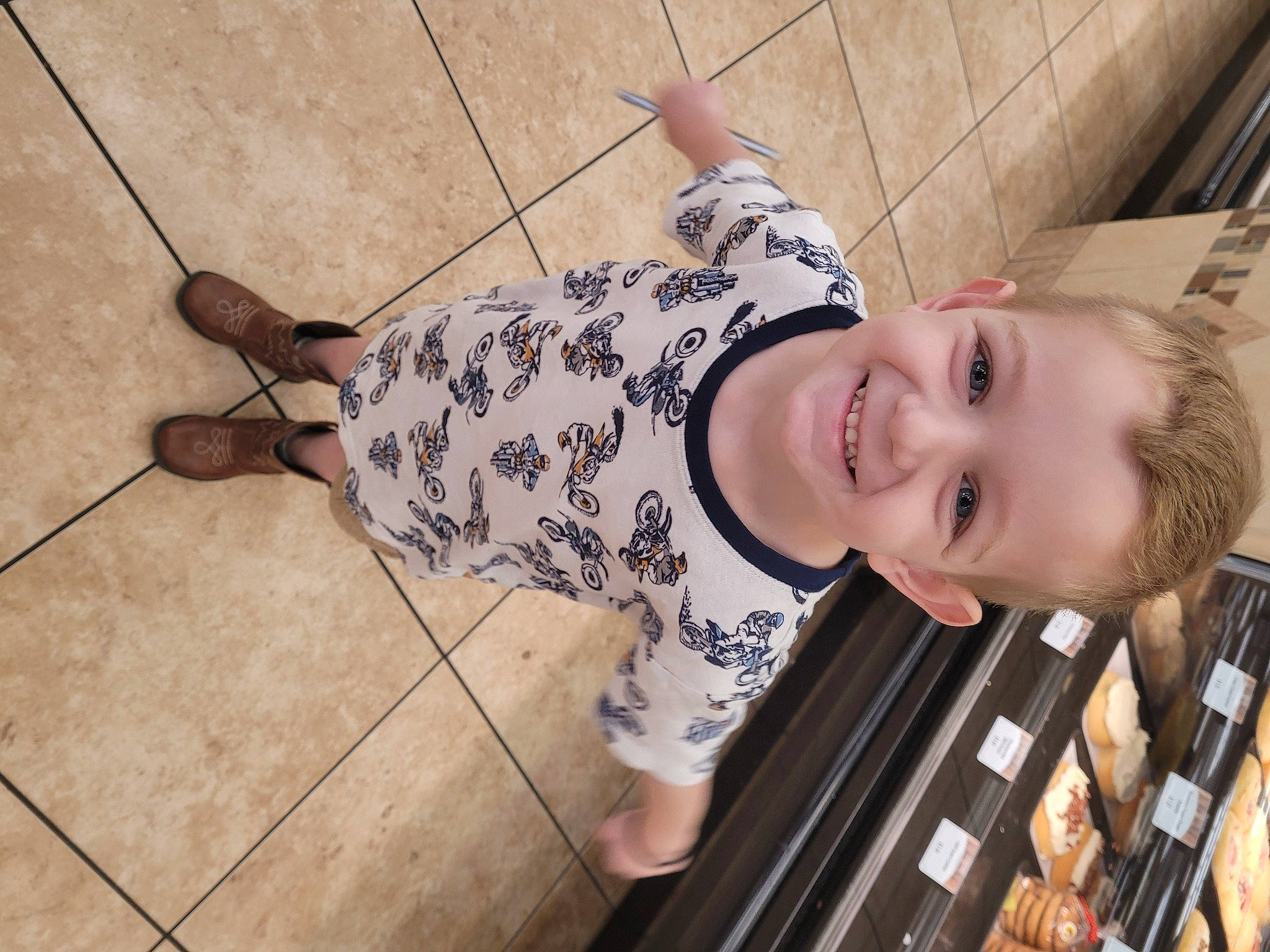 Kadyn is registered to the contest to win money with this photo: bangs, child, flash_photography, floor, flooring, fun, happy, human_leg, joint, joy, knee, leg, pattern, person, sandal, smile, sneakers, street_fashion, thigh, toddler