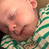 Julian is registered to the contest to win money with this photo: baby, sleeping, infant, face, ear, clothing, striped, green, white, cozy, peaceful, resting, child, newborn, cute, soft, portrait, closeup, indoors, person