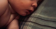Julian joined the competition — help win amazing prizes! baby, calm, child, closeup, cute, face, hand, indoors, infant, peace, peaceful, pillow, plaid, portrait, rest, skin, sleep, sleeping, soft_light, young