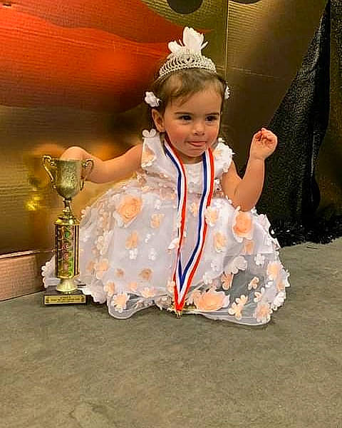 Karlie joined the competition — help win amazing prizes! child, child_model, costume, fun, hair_accessory, headpiece, joy, person