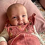 Poppy Rae joined the competition — help win amazing prizes! baby, infant, pink, clothing, smile, face, pillow, cute, child, person, eyes, hand, fabric, pattern, indoors, soft, cheeks, sleeves, button, resting