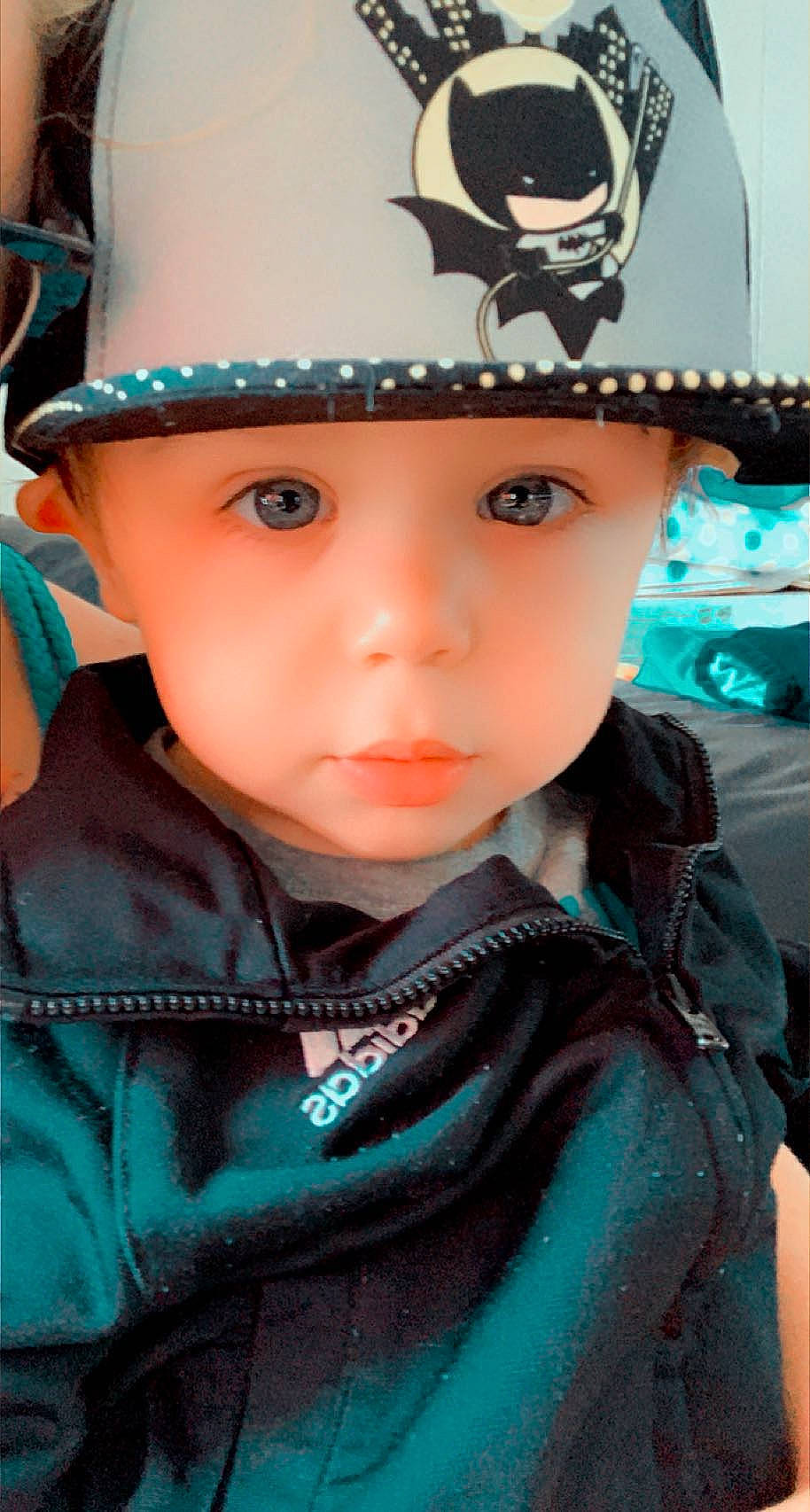 Westley is registered to the contest to win money with this photo: blue, cap, cheek, cool, costume_hat, electric_blue, eyelash, happy, hat, headgear, headwear, helmet, nose, organ, person, photograph, pink, recreation, sports_gear, street_fashion