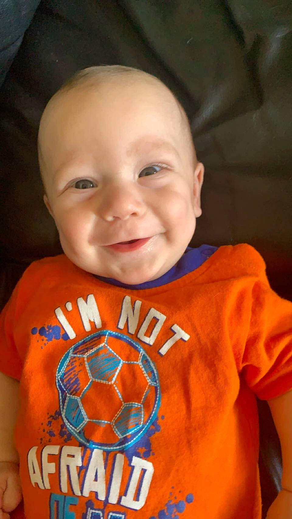 Braxtyn joined the competition — help win amazing prizes! arm, baby_toddler_clothing, chin, cool, eye, face, finger, happy, human_body, jersey, joy, mouth, muscle, neck, orange, organ, person, sleeve, smile, sportswear