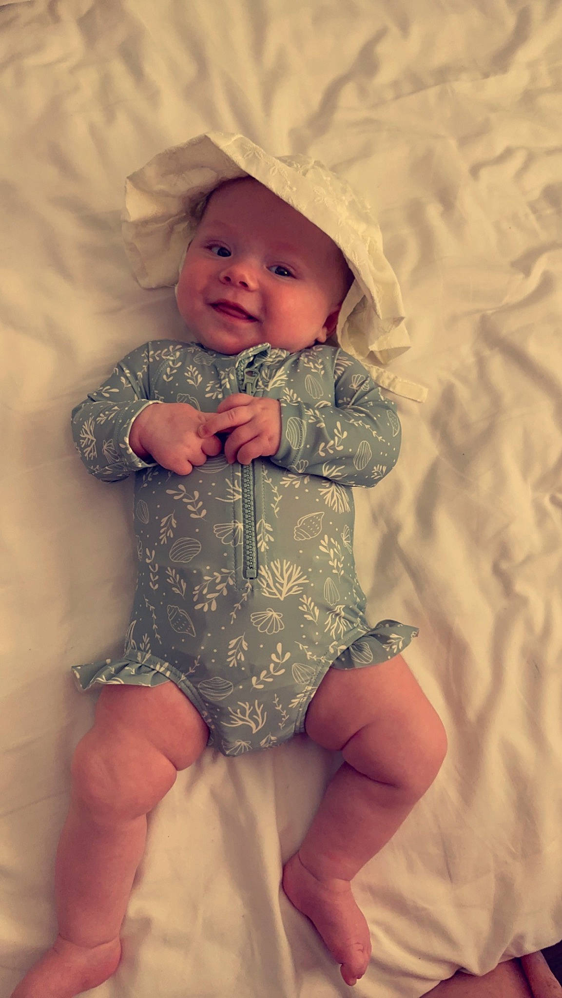 Armani is registered to the contest to win money with this photo: baby, baby_toddler_clothing, chest, comfort, dress, eye, happy, headwear, human_leg, iris, knee, leg, lip, mouth, person, skin, sleeve, smile, stomach, thigh