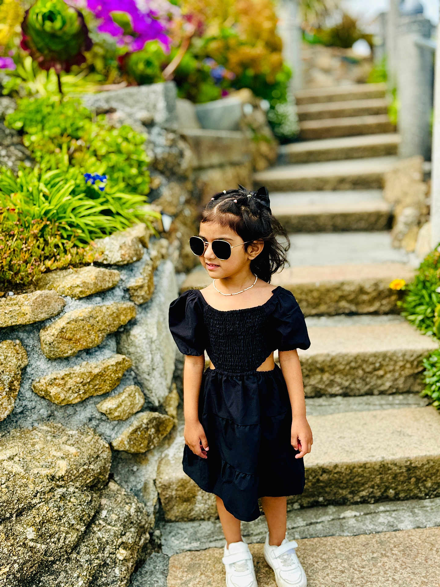Ivana is registered to the contest to win money with this photo: accessories, child, clothing, dress, face, female, girl, head, jar, path, person, photography, plant, planter, portrait, pottedplant, rock, sleeve, sunglasses, walkway