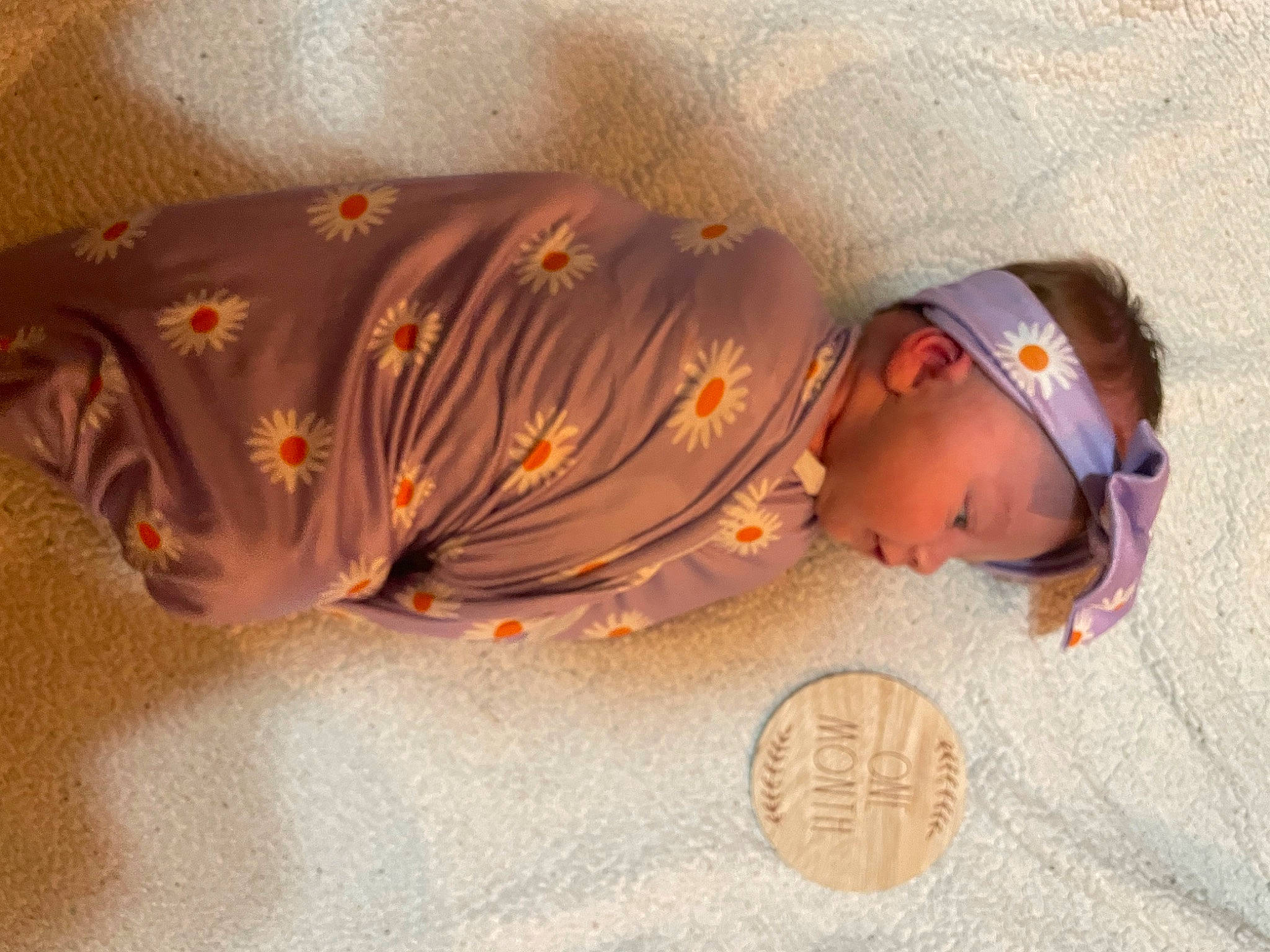 Ellie joined the competition — help win amazing prizes! art, baby, baby_toddler_clothing, bedtime, child, comfort, eye, face, fashion_accessory, flooring, fun, happy, headgear, headwear, linens, nap, orange, person, sitting, skin