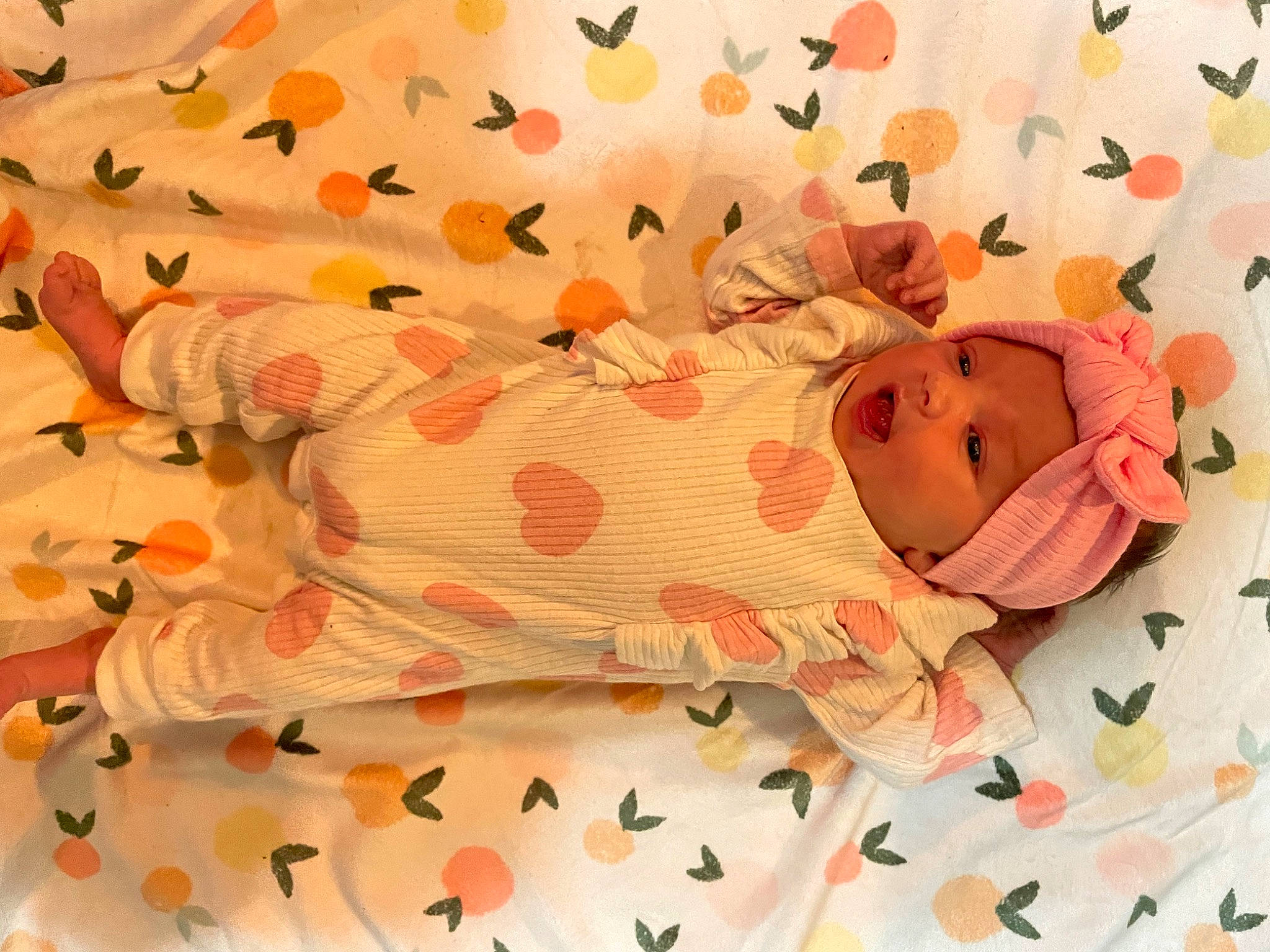Ellie joined the competition — help win amazing prizes! baby, baby_products, baby_toddler_clothing, bed_sheet, bedding, carmine, child, happy, headwear, linens, orange, paper, paper_product, pattern, peach, person, petal, pink, polka_dot, room