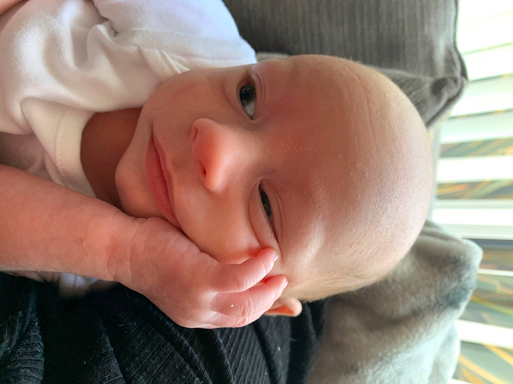 Jacob is registered to the contest to win money with this photo: baby, baby_toddler_clothing, cheek, child, comfort, eye, eyebrow, finger, gesture, grass, happy, head, iris, lip, nose, person, skin, smile, textile, thumb