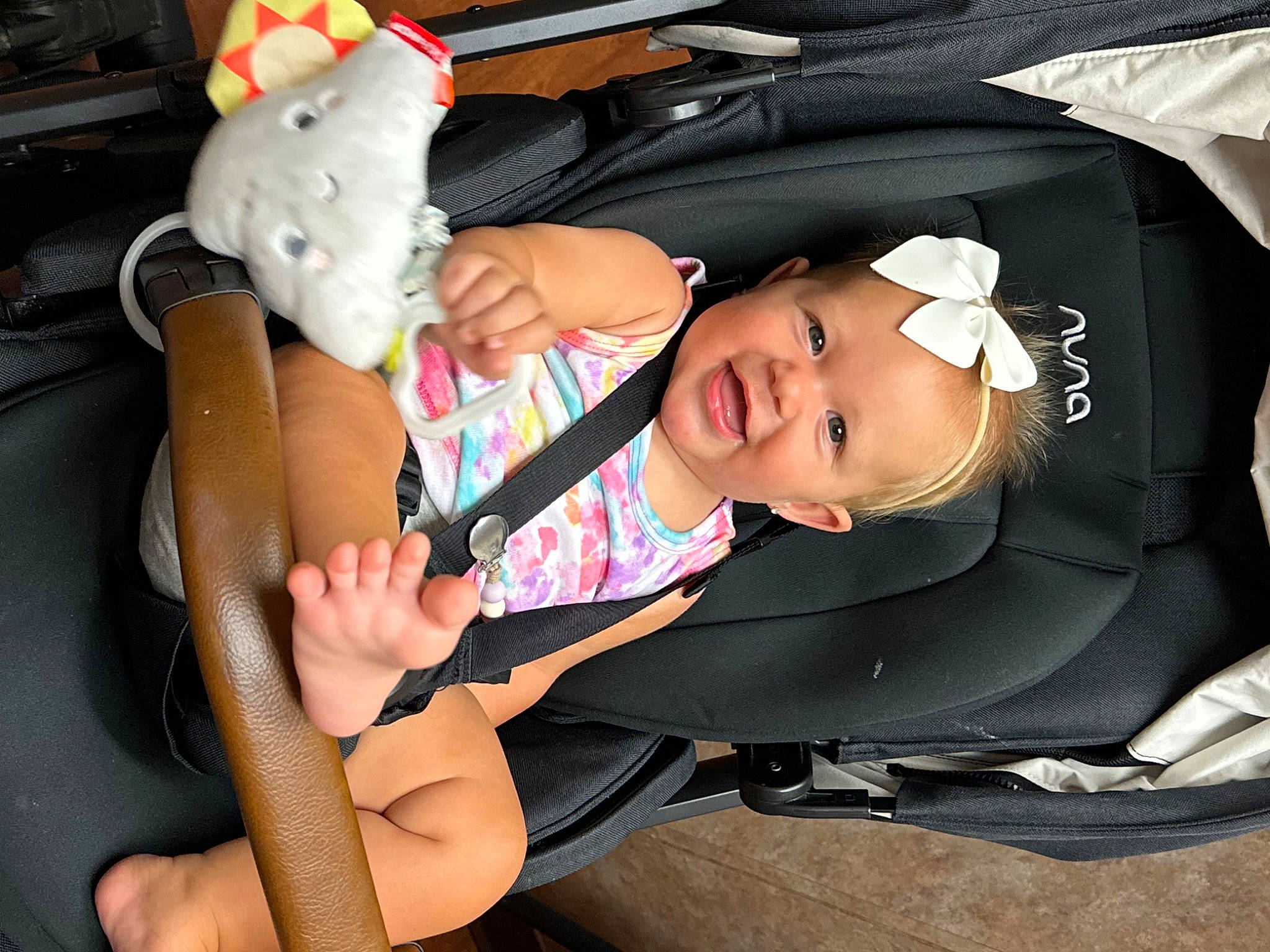 Liliana is registered to the contest to win money with this photo: arm, auto_part, automotive_exterior, baby, baby_carriage, baby_products, baby_toddler_clothing, car_seat, child, comfort, fun, hand, joy, lap, luxury_vehicle, motor_vehicle, person, shorts, smile, toddler