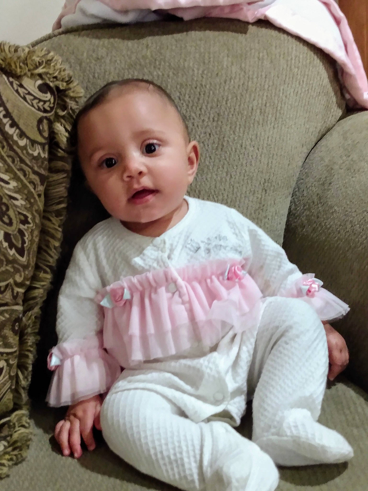 Jolene is registered to the contest to win money with this photo: baby, baby_toddler_clothing, cheek, child, comfort, mouth, nose, person, pink, sitting, skin, sock, toddler