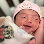 Haisley joined the competition — help win amazing prizes! newborn, baby, infant, smiling, blanket, hat, sleepy, cute, face, skin, hand, wrapped, cozy, indoors, portrait, headwear, expression, peaceful, soft, resting
