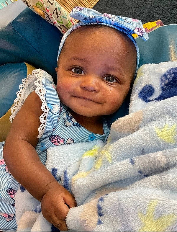 Kara joined the competition — help win amazing prizes! azure, baby, baby_products, baby_toddler_clothing, cheek, child, comfort, event, eye, finger, fun, hair, happy, head, iris, linens, person, product, skin, smile