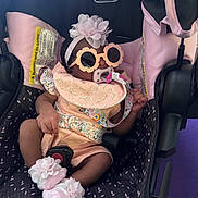 Kori joined the competition — help win amazing prizes! baby, infant, stroller, evenflo, pacifier, sunglasses, headband, flower, bib, sock, pink, black, clothing, baby_accessory, cute, child, person, seat, car_seat, relaxing