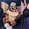 baby, infant, stroller, evenflo, pacifier, sunglasses, headband, flower, bib, sock, pink, black, clothing, baby_accessory, cute, child, person, seat, car_seat, relaxing