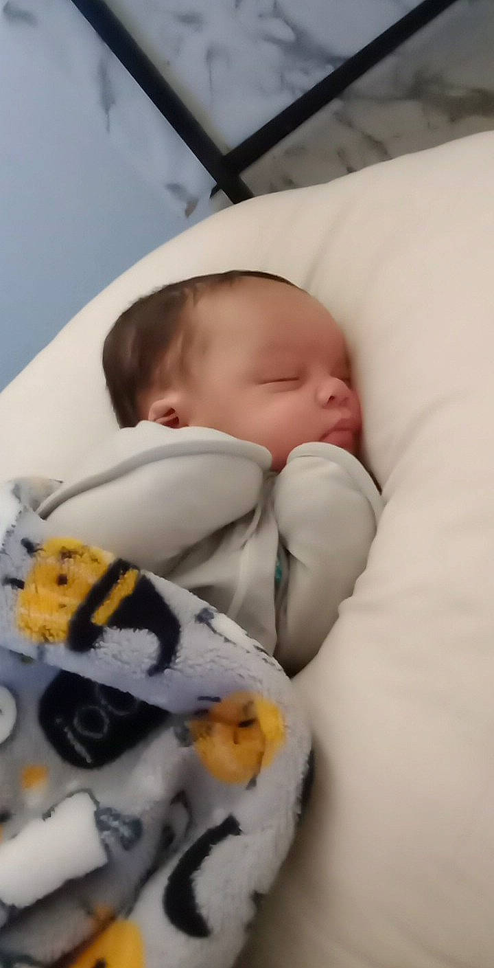 Haiden is registered to the contest to win money with this photo: baby, baby_products, baby_sleeping, baby_toddler_clothing, bedding, bedtime, cheek, child, comfort, human_body, linens, nap, pattern, person, portrait_photography, room, sleep, toddler, white