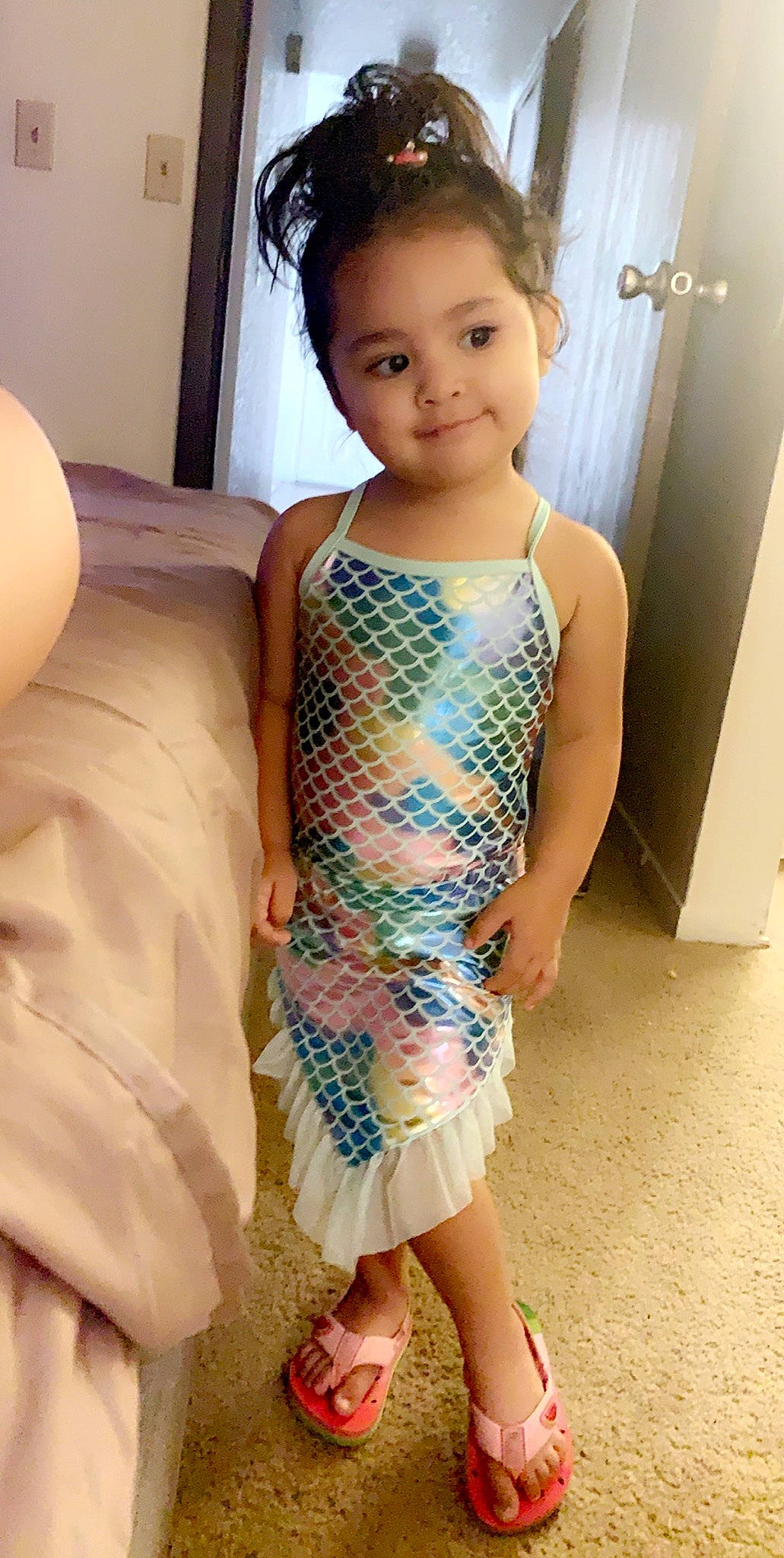 Angela is registered to the contest to win money with this photo: ankle, baby_toddler_clothing, child_model, clothing, day_dress, door, foot, headband, human_leg, joint, joy, nightwear, one_piece_garment, person, sandal, shoulder, skin, sleeveless_shirt, slipper, standing