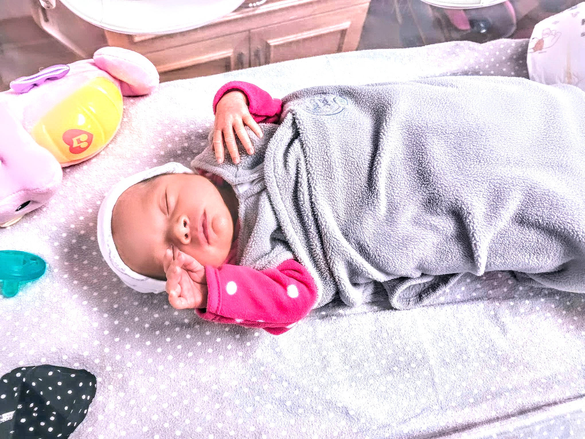 Amaris is registered to the contest to win money with this photo: baby, bed_sheet, bedding, bedtime, blanket, child, comfort, flooring, happy, leisure, linens, magenta, nap, pattern, person, pink, purple, room, sleep, textile