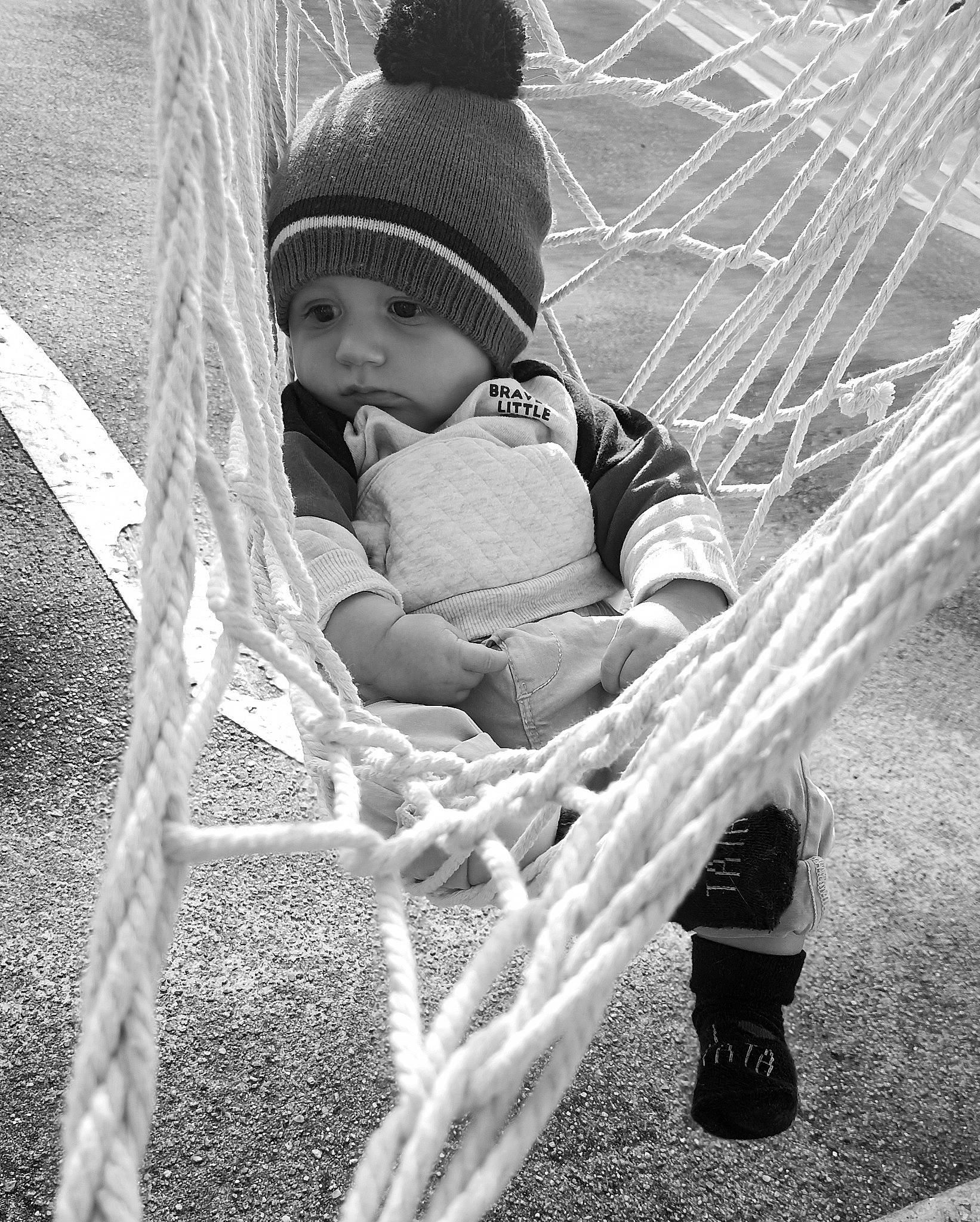 Owen a rejoint le concours — aidez-le/la à gagner de superbes lots ! baby, baby_products, black, black_and_white, cap, child, flash_photography, fun, grass, happy, headwear, monochrome, monochrome_photography, people_in_nature, person, plant, sitting, stock_photography, style, toddler