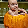 baby, pumpkin, child, kitchen, jar, sitting, orange, cute, skin, face, expression, indoors, food, vegetable, holiday, autumn, smile, hands, legs, background